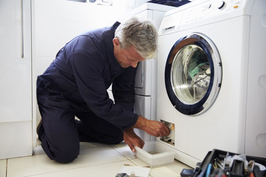 Plumber fixing water leak