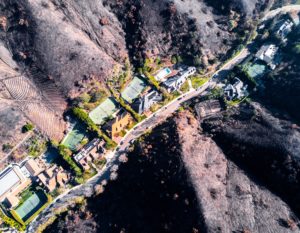 a-neighborhood-at-the-wildland-urban-interface-is-surrounded-by-scorched-hills-after-the-2017_t20_wl3Nv8